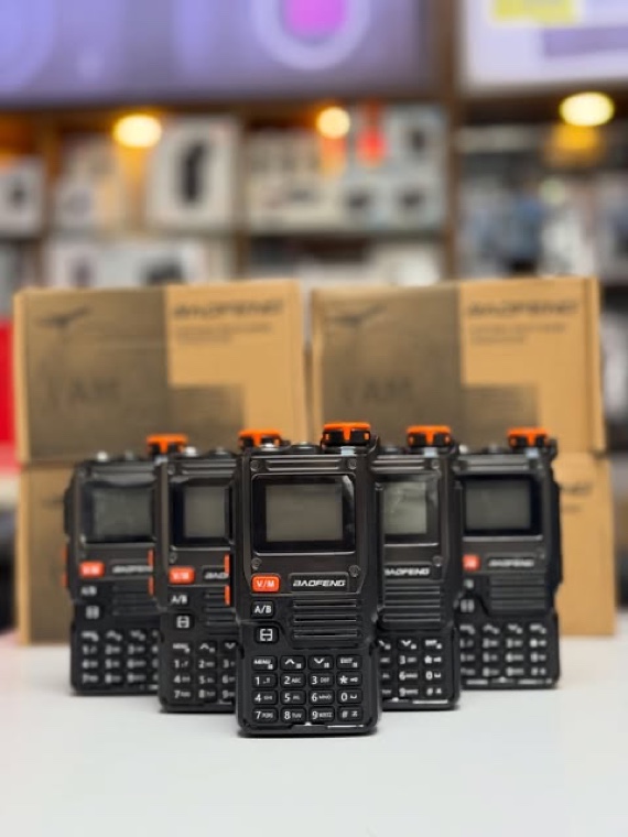 Two-way radios lined up on the counter